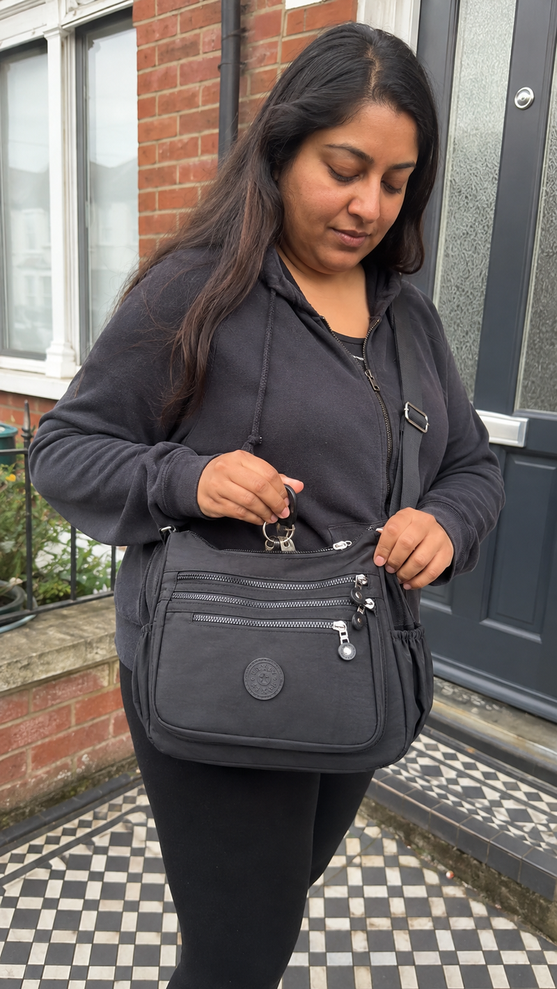 Everyday Organiser Crossbody Bag in Black photographed leaving home on a suburban school run