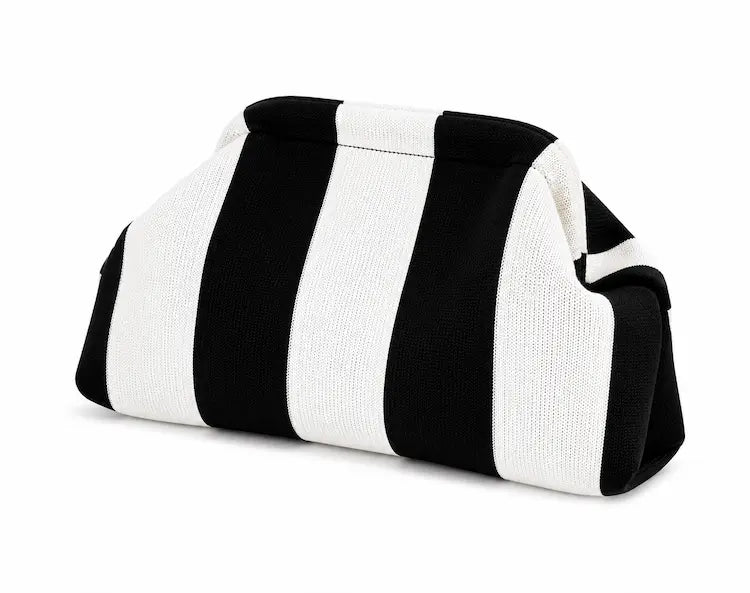 Portofino Knit Clutch — lifestyle shot on neutral background