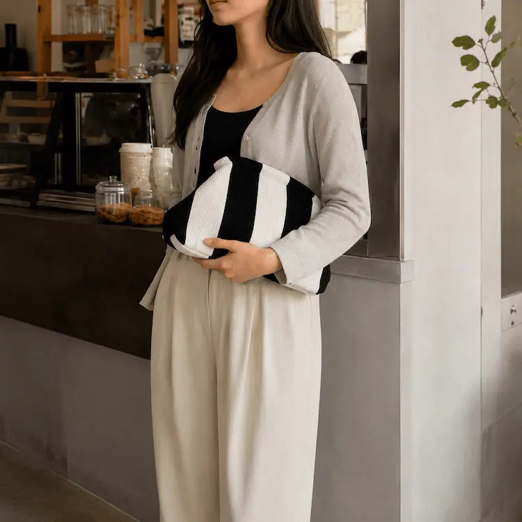 Portofino Knit Clutch — front view of striped cloud silhouette