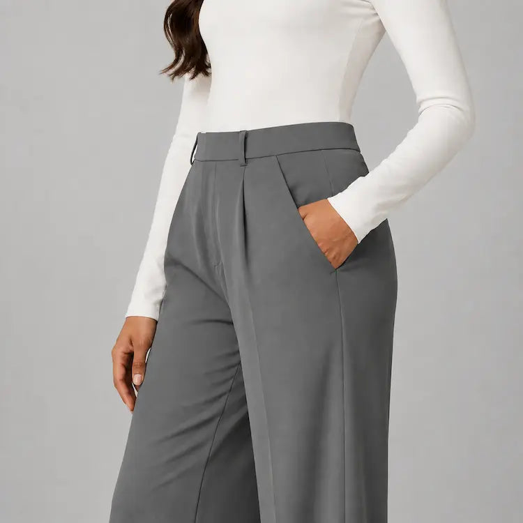 Close-up of the diagonal side pocket on the dark grey trousers