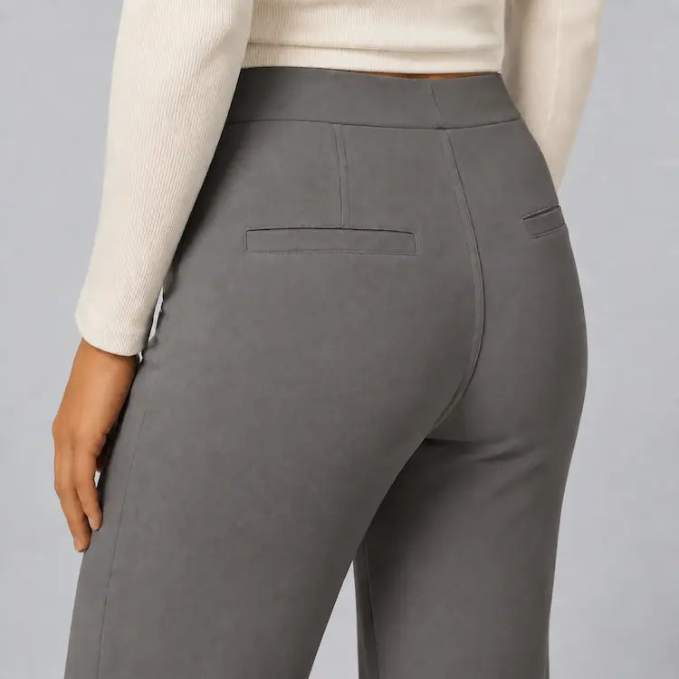 Back detail of the dark grey trousers showing rear welt pockets and stitching